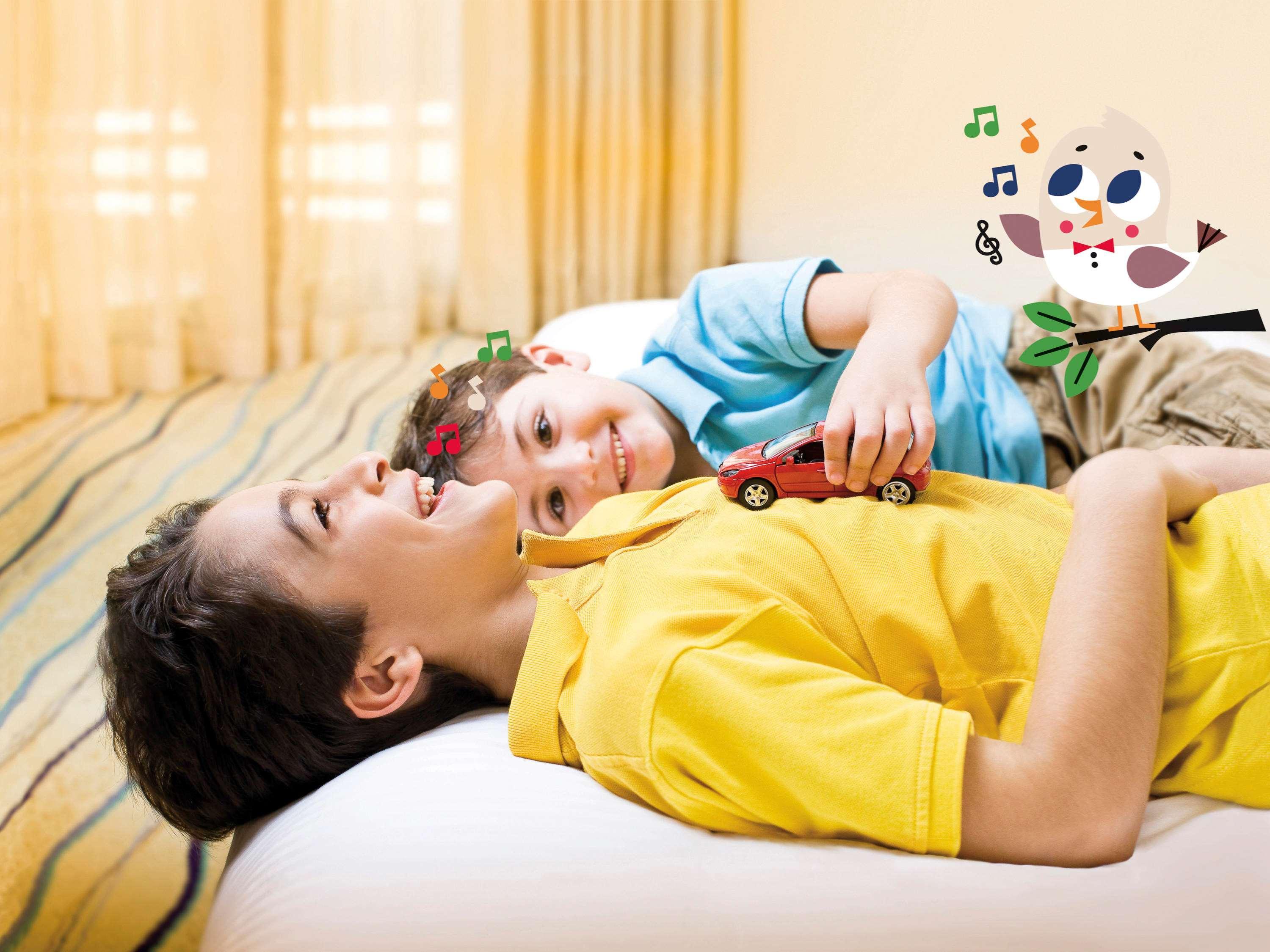 Moevenpick Hotel & Casino Malabata Tanger מראה חיצוני תמונה A child with autism playing with a toy
